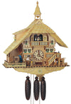 8-Day Schneider Chalet Coocoo clock with music. The clock is made of natural light-colored wood. There is a sawmill and waterwheel with a wood chopper on the left. A bench sits underneath the dial, a small deer is eating off a feeder on the right and water trough. A dog at the bottom of the stairs is watching. Two double windows flank the dial on the upper level. The dancers spin on the upper balcony above. There is a dormer window on the left of the shingled roof, topped by a bell tower.