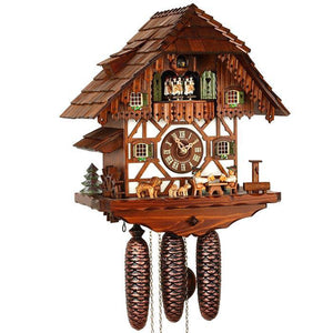 8-Day Schneider Black Forest coocoo clock with music. The chalet is white with dark wooden timbers in the lower half and a dark wood upper half. Two men are sitting drinking beer at a table, a wooden water pump and trough on the right. A St. Bernard dog with 2 puppies are watching and a waterwheel with fir tree sits on the left. The four windows are decorated with flowers in window boxes and dancers spin on the balcony above. The roof has shingles. 