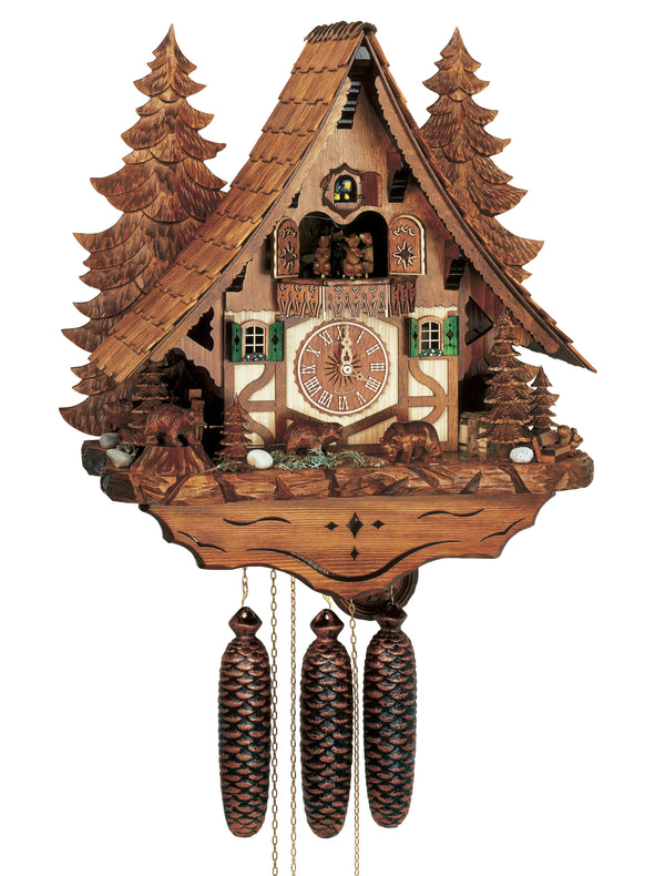 8-Day Black Forest Chalet Schneider coocoo clock with music. The chalet is white with brown timbers in the lower half and a brown wooden upper half. There are green fir trees, a squirrel, a bench and rocks on the right and left corner. Three bears are roaring amidst foliage. The dial is flanked by two windows with green shutters and floral window boxes. On the balcony above bears are dancing to the music. Behind the chalet there are two tall brown carved trees that reach the roof top. 