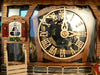 Transparent Glass Clock Dial with the Inner Workings of the Clock Movement on a Schneider Cuckoo Clock