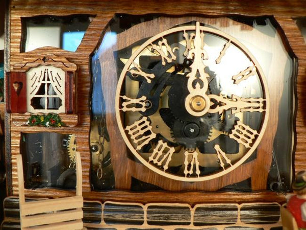 Transparent Glass Clock Dial with the Inner Workings of the Clock Movement on a Schneider Cuckoo Clock