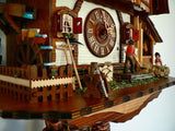 Water Wheel with Farming Tools and a Girl and a Man on Schneider Chalet Black Forest Cuckoo Clock