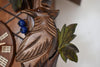 Detailed carved Bird surrounded by Blueberries and Ivy leaves on a Traditional Schneider Cuckoo Clock