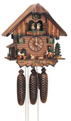 8-Day Black Forest Chalet coocoo clock. The log cabin like face of the clock has a wood-shed on the left side. A man is drinking his beer on the left front corner, a dog is watching him. On the right, a wood chopper is chopping wood and there is also a green fir with a pile of wood on the corner. The two windows on either side of the dial have green shutters and flower boxes. The dancers spin above the balcony decorated with flowers. The cuckoo comes out above the dancers. The roof is smooth.