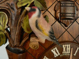 Goldfinch-Bird sitting on Branch next to the Cuckoo Door on a Traditional Anton Schneider Cuckoo Clock
