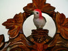 Woodpecker framed by Ivy Leaves nesting on Top of a Traditional Schneider Black Forest  Cuckoo Clock 