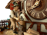 Bavarian Man chopping Wood next to the Clock Dial on a Half-Timbered Schneider Chalet Cuckoo Clock