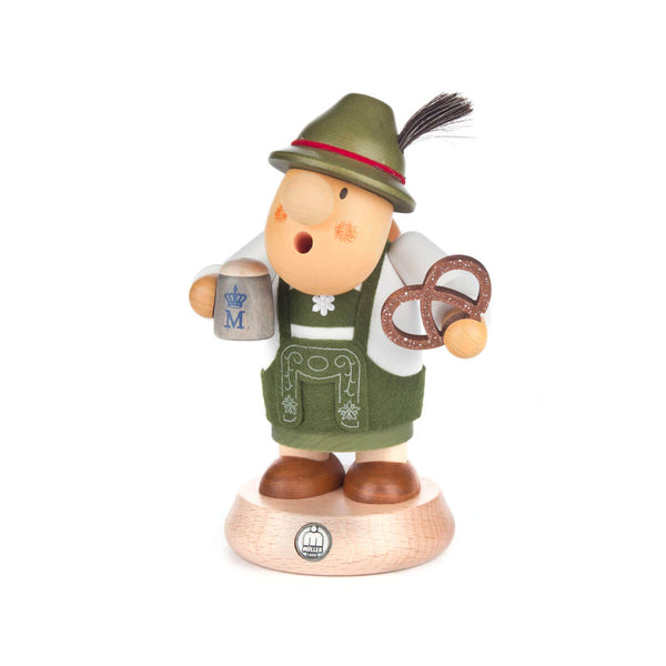 This stunning hand carved German smoker is dressed in the traditional German outfit of a Bayer, a German term meaning a real Bavarian. The body lifts away from the feet to house the incense cone and smoke flows from the mouth when the smoker is in use.  This chubby Bavarian is holding his grey beer stein and a large pretzel, wearing his Lederhosen and Bavarian hat with chamois tuft proudly.
