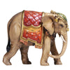 Capture the beauty of the holidays with this unique PEMA Kostner Nativity - Elephant. Hand-carved out of wood and hand-painted, this detailed elephant figurine wears a red blanket, adorned with traditional decorations and a golden, fringed edge, and a tasseled headdress. Bring festive joy to any room with this eye-catching holiday decor!