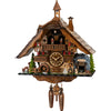  This battery-powered Black Forest cuckoo clock is adorned with a crystal mine entrance, a hammering miner brings life to its intricate design. A turning mill wheel on the left adds a touch of rustic charm, while a faithful St. Bernard stands guard by the cave entrance on the right. On each side of the clock dial is a cute little balcony, another wider balcony sits above the dial and dancers spin around. 