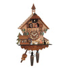 This battery-operated cuckoo clock creates a charming atmosphere with its lovely bell tower and unique light brown stain. A delightful scene unfolds, featuring a kissing couple sitting on a bench, a playful puppy dog and a melodious songbird watching over them. The mill wheel turns, and the dancers up on the balcony twirl joyfully. This bell tower on the roof adds another charming feature to this hand-carved Black Forest cuckoo clock.