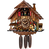 This Engstler Cuckoo Clock is a stunning timepiece crafted in the traditional style of the Black Forest of Germany. It features an 8-Day mechanical movement and hand-carved and hand-painted details of a man sitting at a table drinking beer, being threatened by a woman behind him holding a rolling pin. A waterwheel, pine trees, a water trough complement the scene. The dancers twirl on the balcony, above them the cuckoo comes out behind his door. The shingled roof features a chimney.