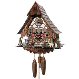Image of Engstler 8-Day Cuckoo Clock depicting a logger and shepherd tending to their duties, with a flock of sheep grazing nearby, a roaming deer, and a tiny songbird. The clock features a uniquely arched, hand-shingled roof, vibrant red shutters, and lovely gingerbread detailing.