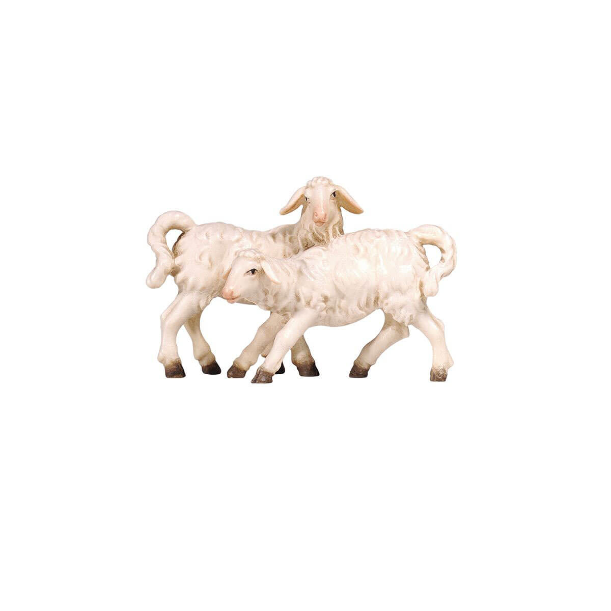 Our PEMA Kostner Nativity group of lambs features two white lambs playing with each other. One lamb stands tall, looking to the right, over the back of the second lamb. The second lamb is captured in motion coming from the opposite way. The two front legs are stretched out, its head gently nudges his friend to come and play. The lambs are hand-carved and hand-painted and an excellent addition to any nativity set.