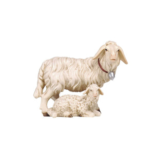 This wooden PEMA Kostner Nativity Group of Sheep is a one-of-a-kind work of art. Precisely hand-carved out of wood and hand-painted, it features a larger sheep, wearing a bell on a collar, standing and looking right and a smaller sheep lying by its side, also looking right. Perfect for any nativity scene, it makes a timeless and unique addition to your holiday decorations.