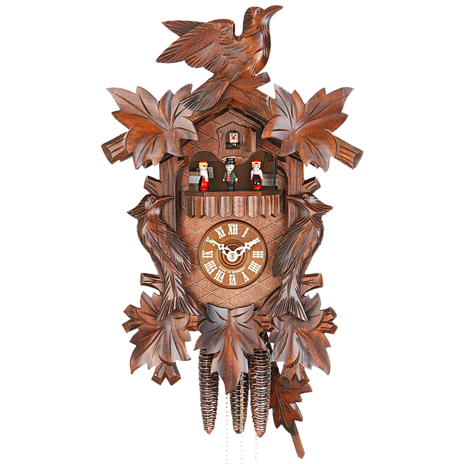 Ornate carved Leaves and Birds frame the Dial and Black Forest Dancers on a Hekas Traditional Cuckoo Clock