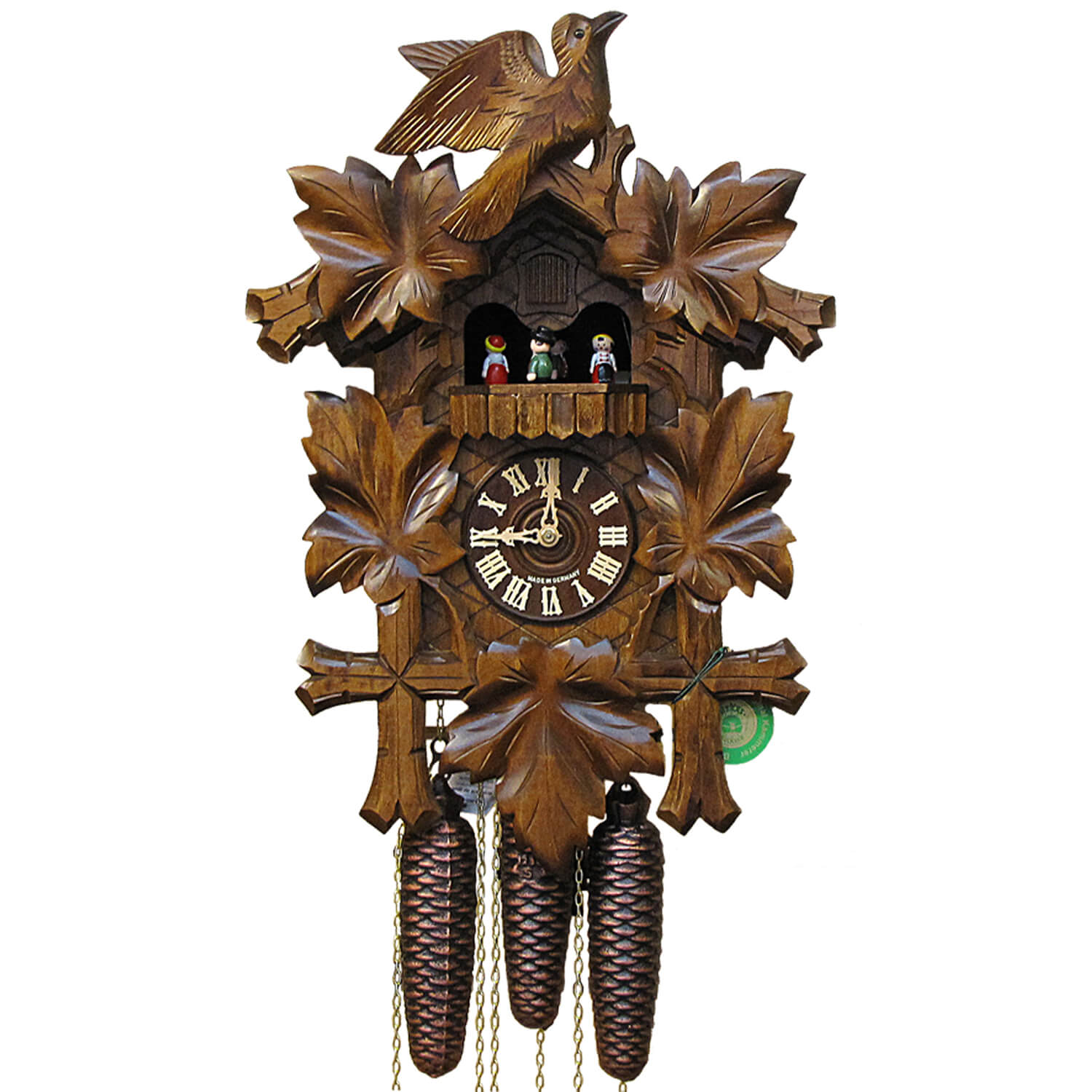 Five Ivy Leaves frame a Traditional Hekas Black Forest Cuckoo Clock with an ornate carved Bird on Top