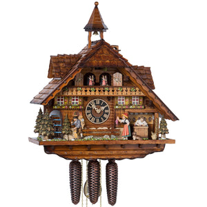 Hones 8 Day Chalet with Lights, Moving Clockmaker, Clock Peddler, Music, Dancers, and Wheel