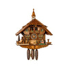 8 day chalet clock with a pig and deer and spinning water wheel. Man on bench slides back and forth to kiss woman.
