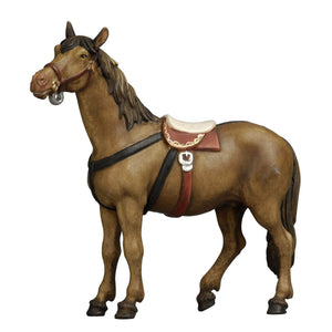 The PEMA Kostner Nativity - Horse features a beautiful, lifelike standing horse with a bridle and a beautifully decorated saddle. Perfect for the holiday season, this detailed figurine will add the finishing touches to your home décor. Hand-carved out of wood by skilled artisans, this horse is sure to become a cherished piece of your holiday tradition.