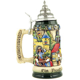 A Beer Stein with traditionally dressed guests drinking beer  in front of a Oktoberfest building and Oktoberfest written on the handle.