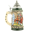 Green beer stein with pewter lid on which you see horses pulling a cart loaded with beer barrels next to the Bavarian flag