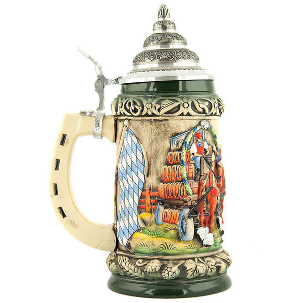 Green beer stein with pewter lid on which you see horses pulling a cart loaded with beer barrels next to the Bavarian flag