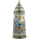 This light colored King Beer Stein has  a fireman in the front with a hose and a trumpet in his hands.  there is a burning house in the background and  a phrase written on the rims. "Ensure that in case of fire, there is something on hand to extinguish. To help where help is needed is a strict commandment of our covenant!