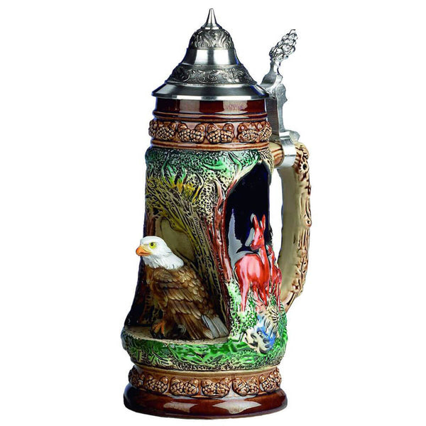 King Beer Stein with a proud bald eagle who sits in a grotto on a stone and observes its environment. The brown and green tones of the Mug underline the nature scenes.