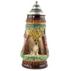 King Beer Stein with am attentive German Shepherd who sits in a grotto on a stone and observes its environment. The brown and green tones of the Mug underline the nature scenes.