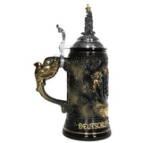 The side of the Beer Stein with a handle in the shape of an eagle painted with gold