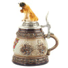 The side of theKing Beer Stein is painted in various shades of brown and has a decorative Edelweiss ornament. On the pewter lid sits a St. Bernard, one of the famous Swiss dog breeds.
