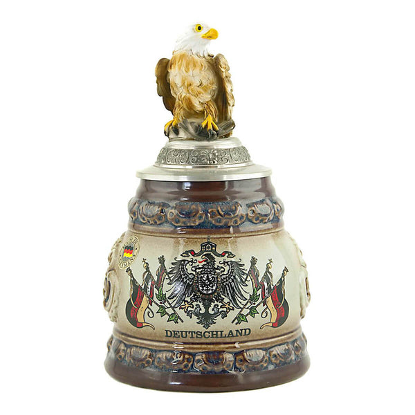 KING beer mug with a proud eagle on the pewter lid. Below the eagle on the brown beer mug the German Eagle with the different German flags is painted and underneath it is written "Germany".