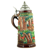 Beer mug with wild boars running through the forest. The handle in the shape of a fox looks like it is winding out of one of the trees.