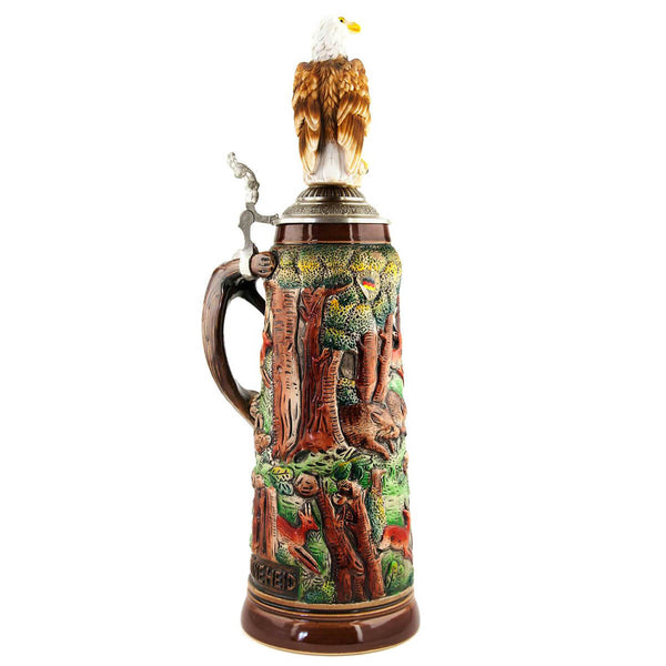 The Back side of an eagle proudly sitting on the German King beer mug decorated with hunting scenes. The detailed handle in the shape of a fox is striking. 