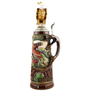 An eagle proudly sitting on the German King beer stein decorated with hunting scenes. The detailed handle in the shape of a fox is striking.