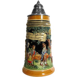 Beer stein with a green tree and a banner with the title for a famous German song “May has come, the trees are budding”