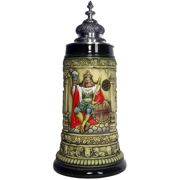 Beer Stein with Gambrinus in his colorful glory, as he proudly sits leaning against a beer barrel, a scepter in one hand and a goblet filled with beer in the other. The lower rim of the Mug is decorated with lions and beer mugs, the upper one is decorated with hops. The decorated pewter lid reflects the shape of his crown.