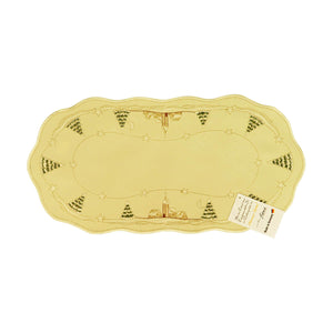 Oval champagne color table runner with scalloped edges. Outer border design of snow covered church and trees, with alternating star designs in between. Interior border is a design of golden threading with stars.