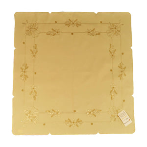 Square cream color tablecloth, with two border rows of Christmas ribbons, flowers, and stars.