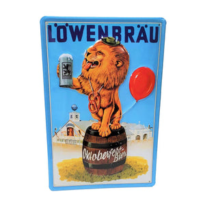 Vintage metal sign for Löwenbräu beer, showing a lion, dressed in Bavarian costume, sitting atop a barrel, holding a mug of beer with the Löwenbräu tent behind.