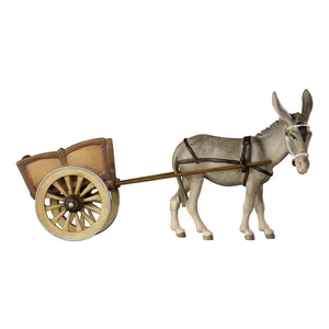 This exquisite PEMA Kostner Nativity Donkey With Cart is carefully hand-carved out of wood by expert craftsmen and hand-painted, giving it a timeless and unique look. The donkey is wearing a white bridle and dark straps where the wooden 2-wheel-cart is hitched to. The donkey is looking to the right. This detailed figure will be perfect for your Christmas decorations, adding a special touch to the holiday season!