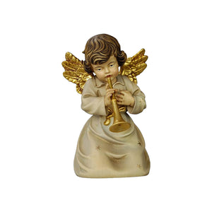 Kneeling Angel playing a trumpet. His golden wings match the dress with small golden stars and a golden bow.
