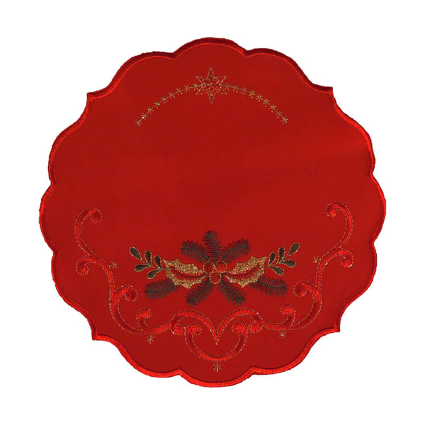 Round red table linen with a design of a bough of holly branches, leaves, and berries, and gold stitching and stars at the top.