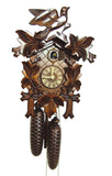 8-Day Traditional Black Forest coocoo clock. The face of the clock around the dial is crosshatched. The frame around the edge of the clock box is decorated with large carved leaves at the bottom and on both sides. The cuckoo bird comes out from its door above the dial. The angled crown piece features two large leaves on either side and a large carved wooden cuckoo bird on top.
