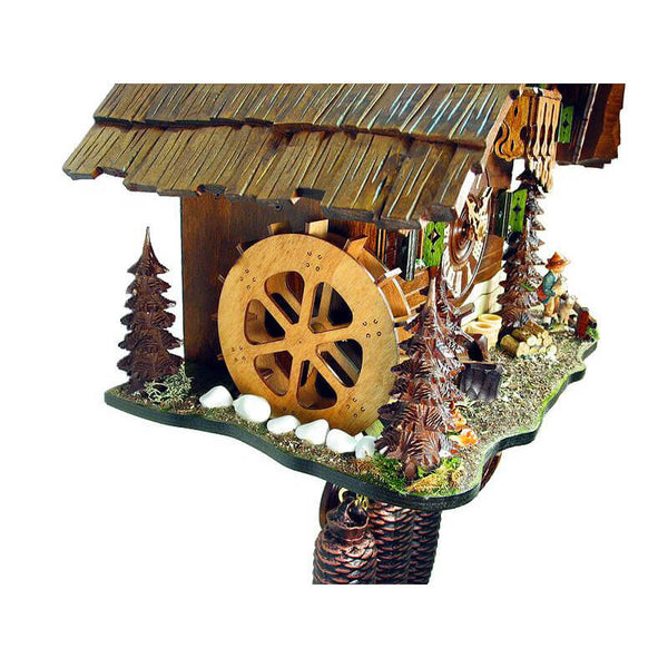 In the back Bavarian Boy holding a Goat Kid and in the Front the Water Wheel on a Schwer Chalet Cuckoo Clock