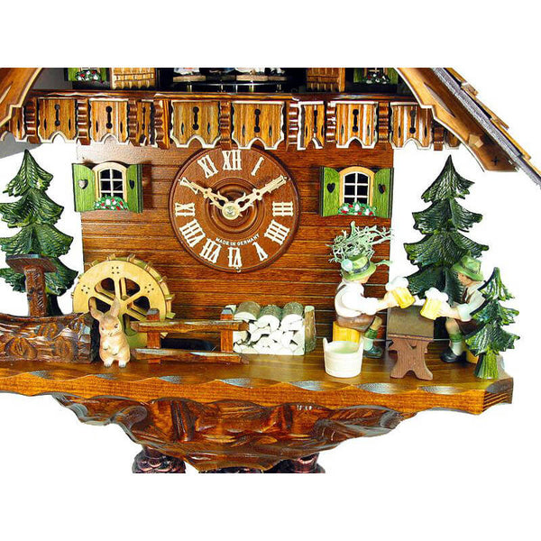 Close up view of the 2 moving beer drinkers on the front of the clock