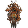 8-Day traditional Black Forest hunter style coocoo clock. The dark stained solid wood clock features a hunted rabbit and pheasant on each side, framed against a continuing trim pattern of woodland leaves and ivy. A hunting horn encircles the clock’s dial, while a powder pouch hangs at the bottom of the base. Above the dial, the dancers spin to the music on a carved balcony. The top features crossed rifles, ivy growing on the trim and a stag head.