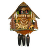8-Day Chalet August Schwer Black Forest coocoo clock. The two-tone solid wood clock features a tree, a bench and ladder on the left. A bird is perched on a tree branch on the left corner, next to a water wheel. A bucket and logs sit underneath the dial, a deer grazes in front of a tree on the right. The right side features stairs and a water well with logs. Dancers spin on the balcony above and the cuckoo comes out above the dancers.