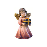 Sculpted wooden Sissi Angel figurine with golden wings in a pink dress, holding a gift wrapped in a gift paper  with a yellow bow.
